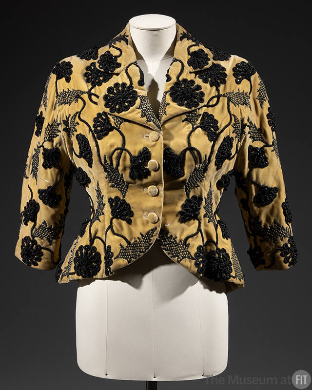 Short, fitted yellow evening jacket with black flroal embroidery and 3/4 length kimono sleeves