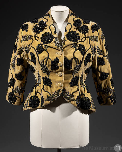 Short, fitted yellow evening jacket with black flroal embroidery and 3/4 length kimono sleeves