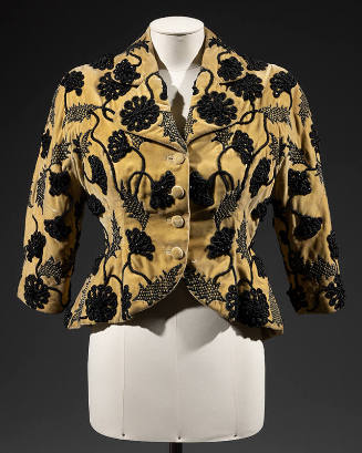 Short, fitted yellow evening jacket with black flroal embroidery and 3/4 length kimono sleeves