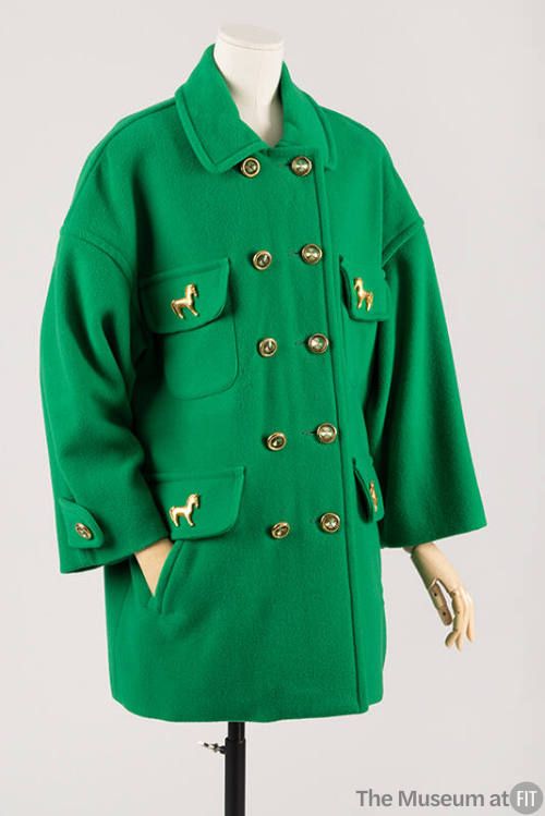 Bright green double-breasted jacket with gold metal buttons and gold horse pins on four pocket …