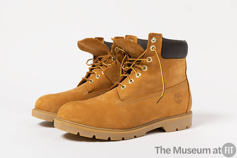 Yellow brown construction boots with black padded collar and yellow laces