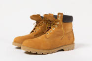 Yellow brown construction boots with black padded collar and yellow laces