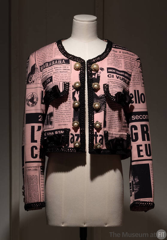 Pink and black cropped long sleeve jacket with newspaper print design and 10 pearl buttons