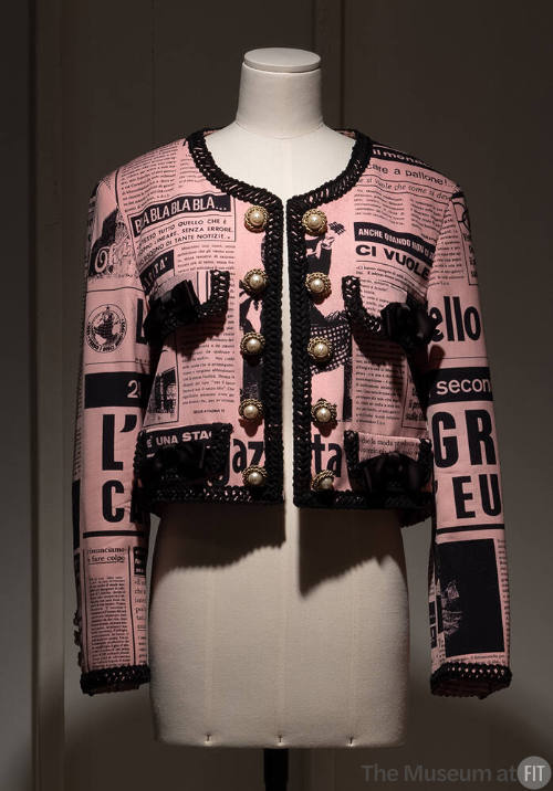 Pink and black cropped long sleeve jacket with newspaper print design and 10 pearl buttons