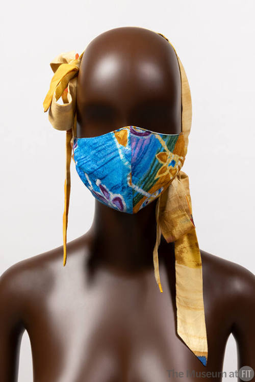 Blue floral design face mask with long dyed yellow side bow ties