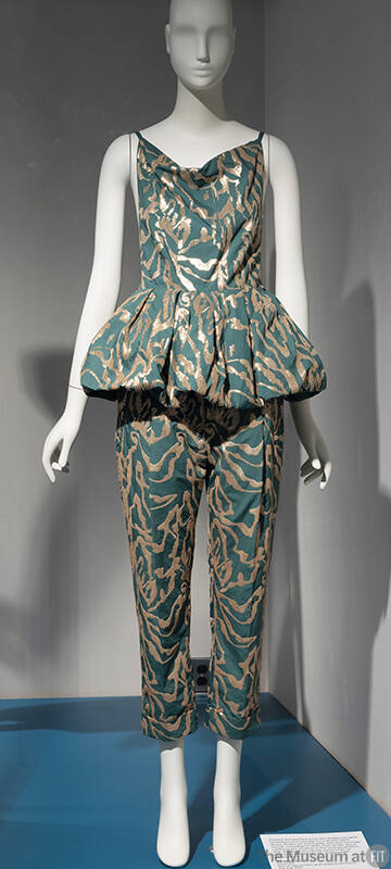 Green camisole strap peplum top with stylized gold sequin embroidery throughout and matching cr…