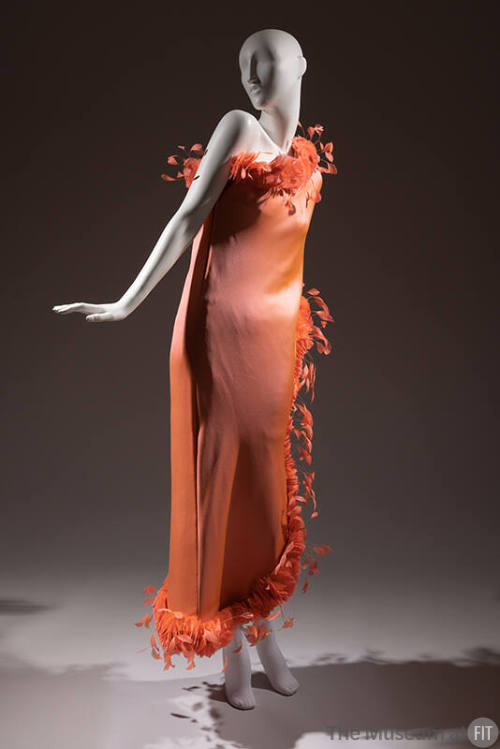 One shoulder orange pink asymmetrical floor length gown with feather trim 