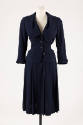 Navy blue suit of fitted button front jacket with wide Chelsea style collar and below calf leng…