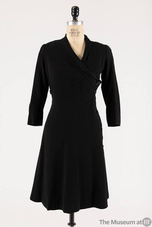 Black wool 3/4 sleeve to-the-knee length coat dress with crossover front with side button closu…