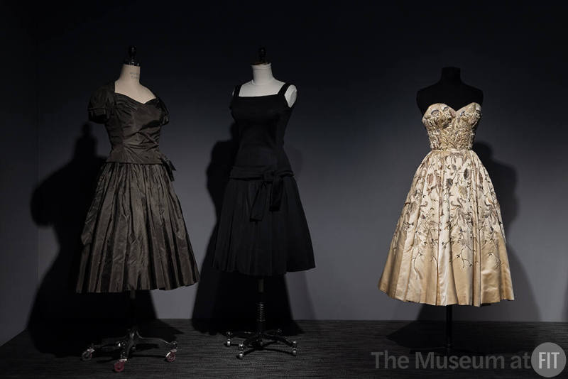 Dior + Balenciaga, Left to right: 82.208.9 (grey dress), 71.213.25 (black dress), 75.86.5 (strapless evening dress)