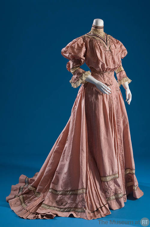Pink two-piece dress with mono-bosom bodice, ¾ flounced sleeves and matching floor length skirt…