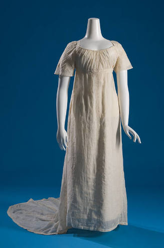 Off-white sheer cotton short sleeve dress with embroidered floral motif, floor length skirt wit…