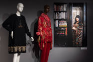 Designing Women exhibition installation view of two mannequins in a black dress and red ensembl…