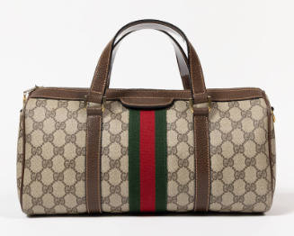 Beige satchel with brown pigskin handles, zipper top, and green and red stripe webbing decorati…