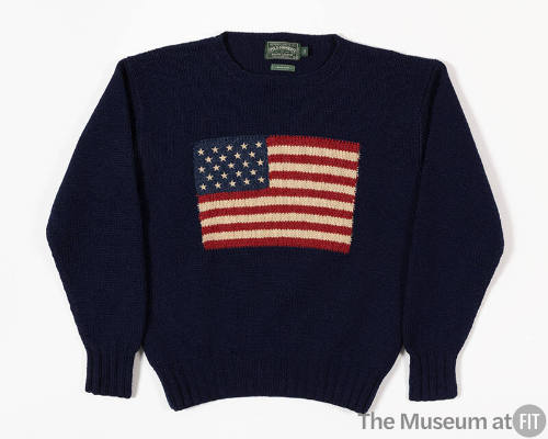 Blue knit long sleeve crew neck sweater with American Flag on front