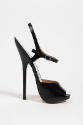 Black open toe sandal with extremely high stiletto heel and ankle strap