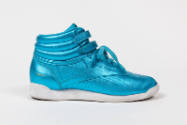 Metallic blue hightop sneaker with double velcro strap ankle closure, white sole and Reebok log…