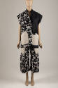 Black with off-white splatter print sleeveless collarless jacket with off-white patch pockets a…