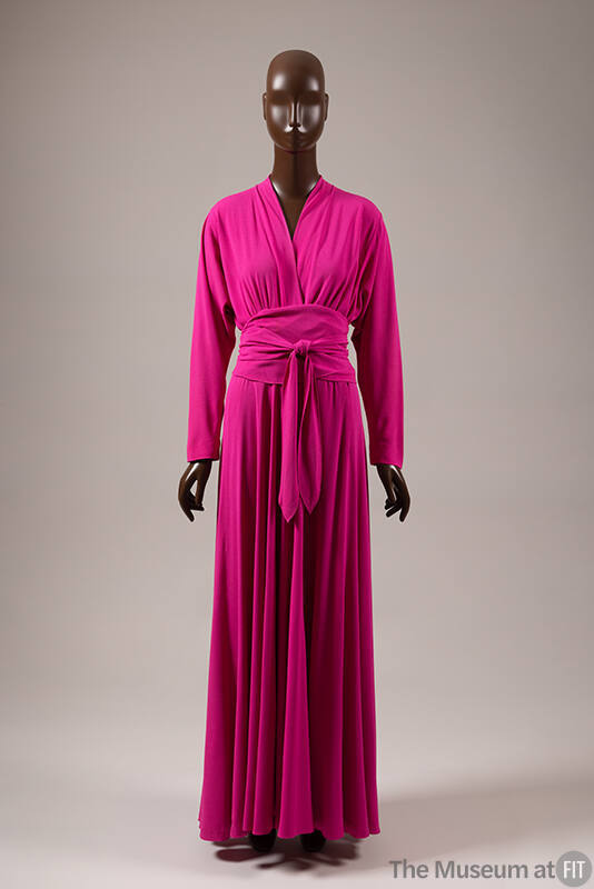 Ankle length fuscia evening dress; peplum style waist created by self wrap tie