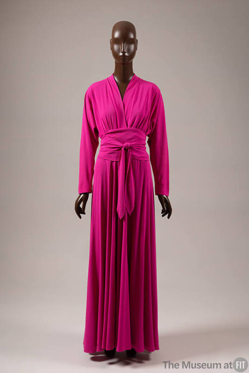 Ankle length fuscia evening dress; peplum style waist created by self wrap tie