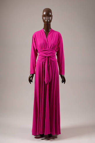 Ankle length fuscia evening dress; peplum style waist created by self wrap tie