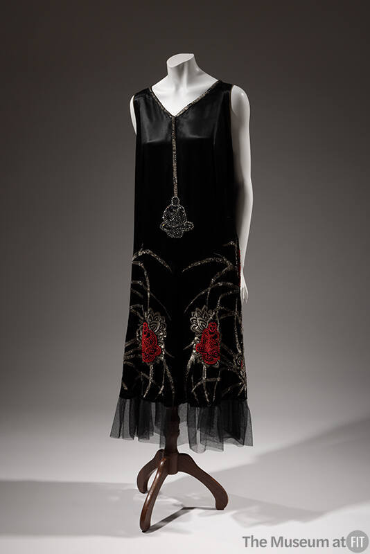 Black sleeveless shift dress with beaded and rhinestone Buddha figures and lotus flowers