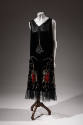Black sleeveless shift dress with beaded and rhinestone Buddha figures and lotus flowers
