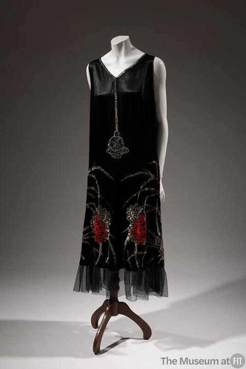 Black sleeveless shift dress with beaded and rhinestone Buddha figures and lotus flowers