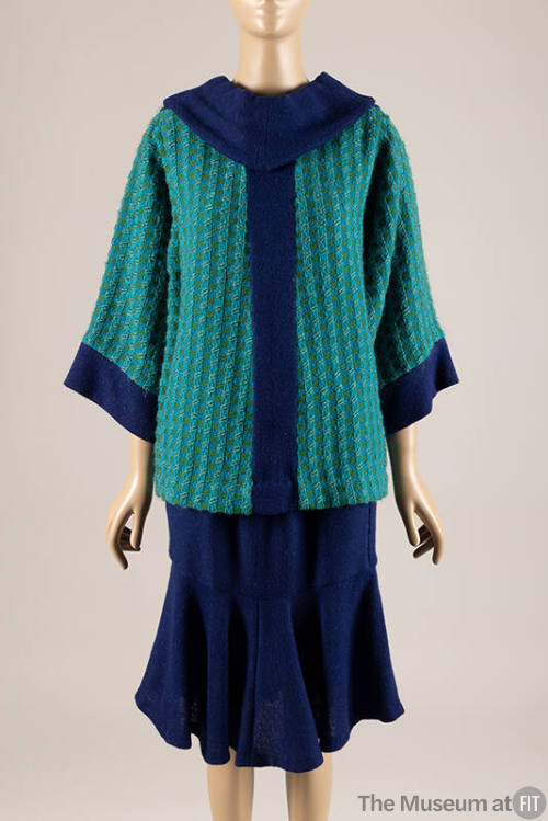 Green & turquoise tunic top with blue collar and vertical stripe, dressed with blue skirt
