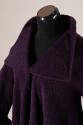 Detail view of large square lapels on purple coat