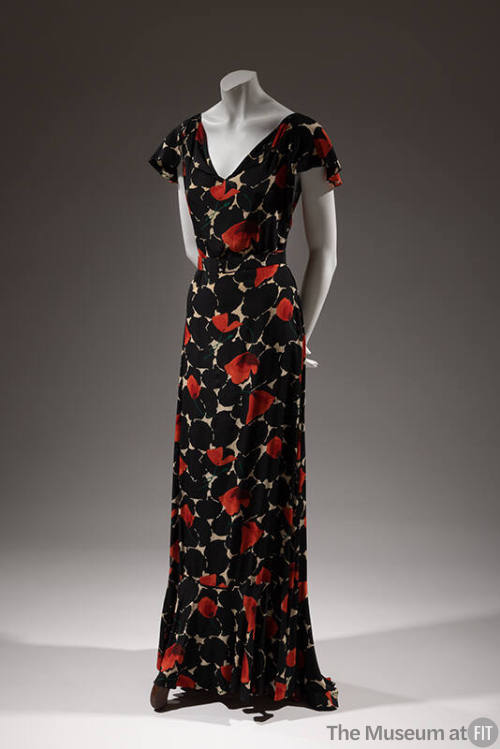 Floor length evening dress, black and white abstract print with red poppies and ruffled cap sle…