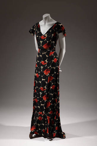 Floor length evening dress, black and white abstract print with red poppies and ruffled cap sle…