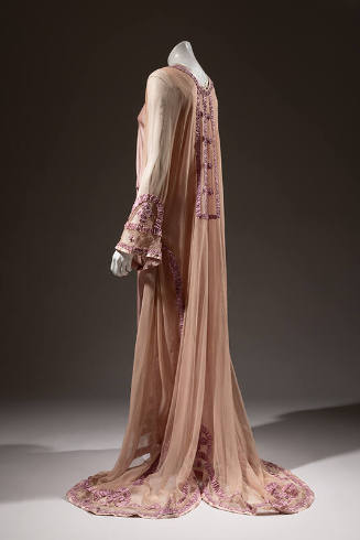 Side view of pink sheer long sleeve nightgown with purple ribbon trim, floor length skirt with …