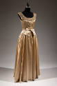 Champagne beige sleeveless and full length evening gown with bronze toned pearl and bugle bead …
