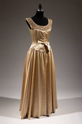 Champagne beige sleeveless and full length evening gown with bronze toned pearl and bugle bead …