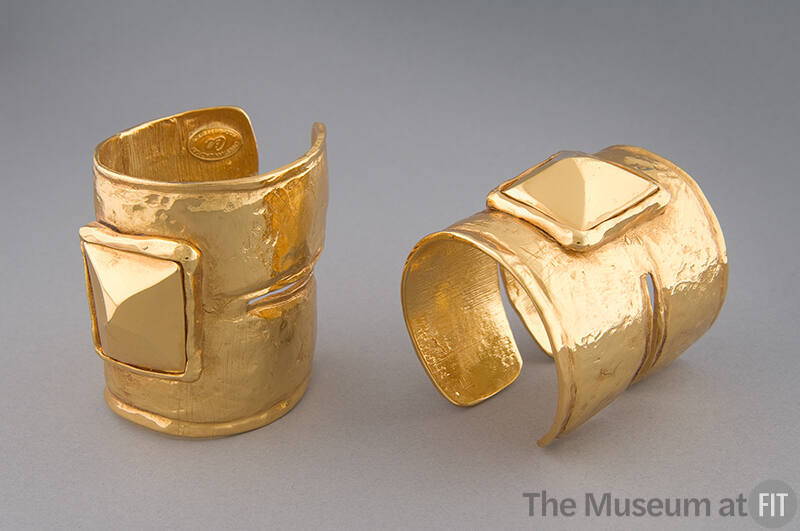 Pair of  yellow gold cuff bracelets set with large pyramid on at outer wrist and shaped with de…