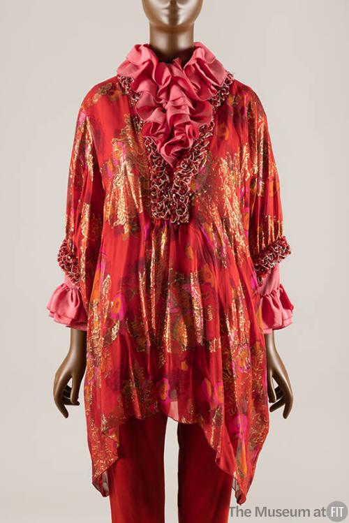 Red caftan style top with orange, pink and gold metallic floral and fruit design, pink ruffled …
