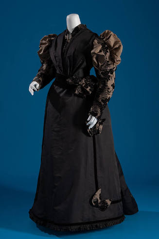 Dark grey floor length dinner dress with cisele velvet long sleeves with shoulder puffs and mat…