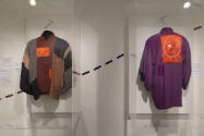 Elizabeth Hawes exhibition installation view of a man’s color blocked kimono and a man’s purple…