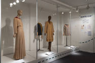 Elizabeth Hawes exhibition installation view of four mannequins in shades of beige, yellow and …