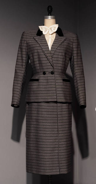 Grey suit with thick and thin horizontal black stripes of jacket with peaked lapels and fitted …