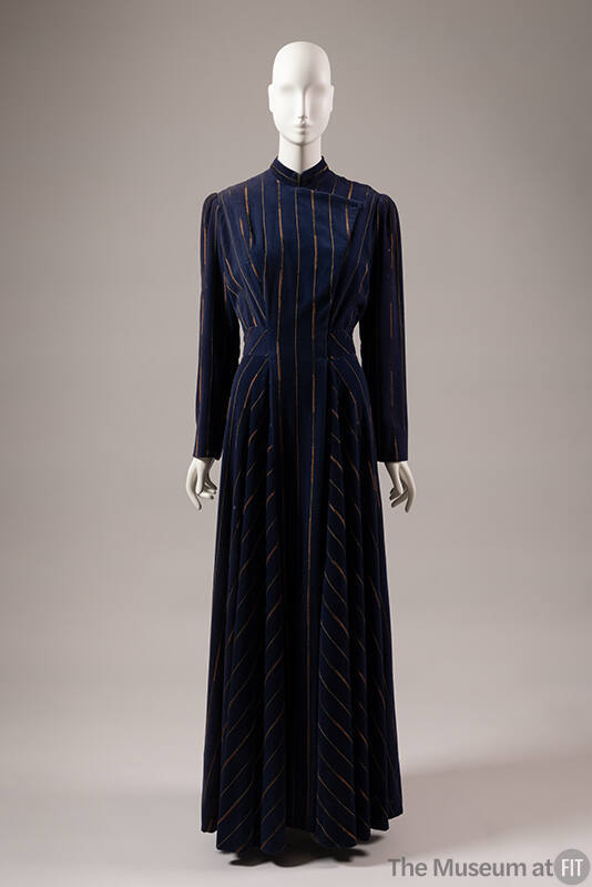 Blue floor length evening coat with vertical metallic gold and copper stripes and flap opening …