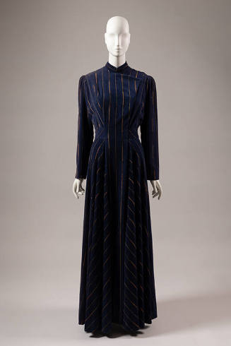 Blue floor length evening coat with vertical metallic gold and copper stripes and flap opening …