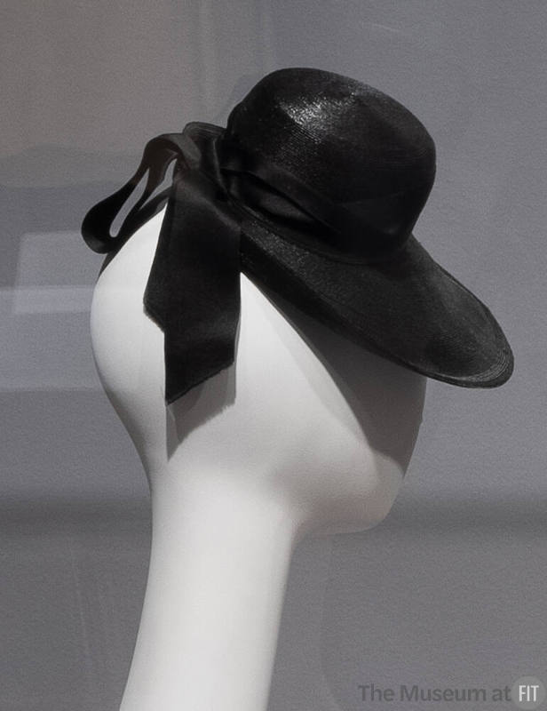 Black straw hat with ribbon tie at back