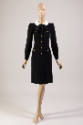Black long sleeve knee length shift dress with white peter pan collar tied with large black bow…