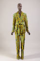 Yellow, blue and black geometric striped pantsuit of shawl collar jacket with sash tie belt and…