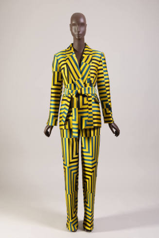 Yellow, blue and black geometric striped pantsuit of shawl collar jacket with sash tie belt and…