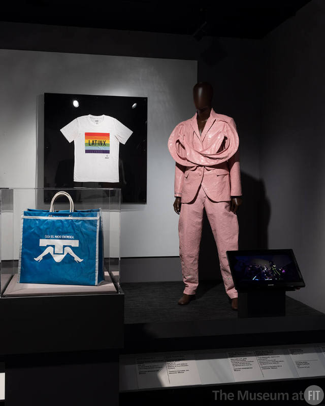 Pink leather Mamado pantsuit (2022.10.1) and bag (2023.2.1) by the Mexican brand Sánchez-Kane and “Latinx Pride” t-shirt by Ricardo Seco (2023.2.2) featured in the section on “Gender” in ¡Moda Hoy! Latin American and Latinx Fashion Design Today.