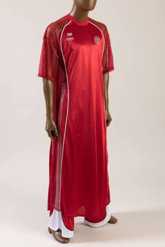 Red uniform jersey top, net sleeves and side panels, white Olympic rings logo on chest, red and…