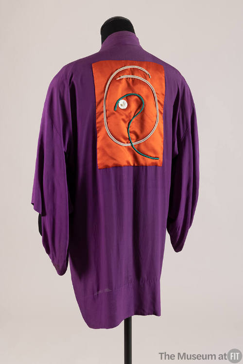 Back view of purple kimono with red back patch with pink, white and green braid design